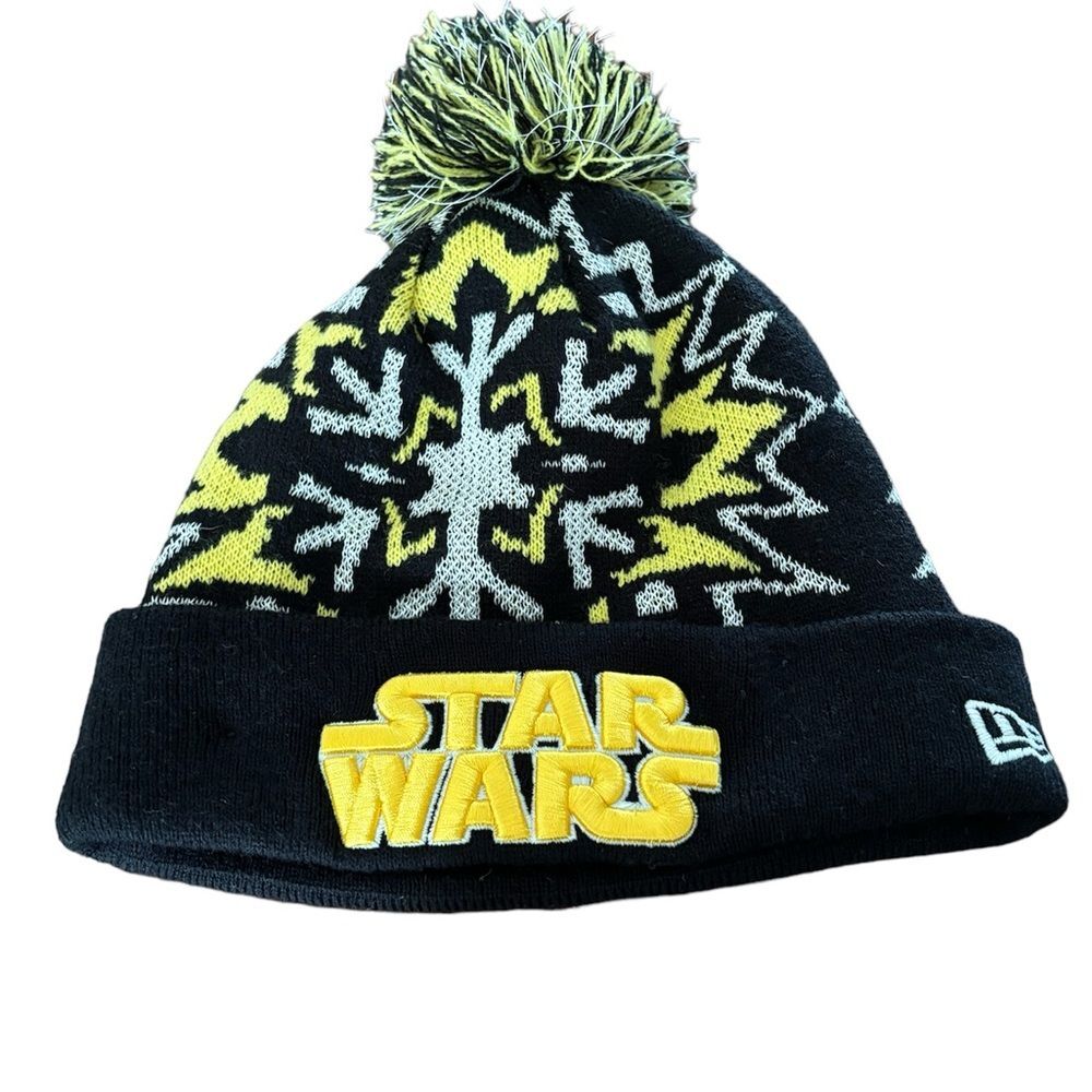 New Era Star Wars beanie with pom pom top yellow black galaxy design winter hat